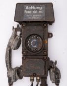 A WWII German Bunker cast iron telephone by Siemens, the bell cover with label 'Achtung,