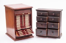 An early 20th century mahogany tambor fronted microscope slide cabinet of twenty-two draws with