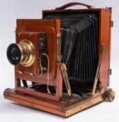 A Thornton Packard 'Triple Imperial' mahogany and brass three quarter plate camera,