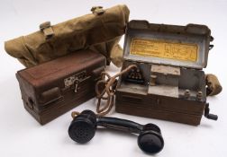 A pair of field Telephone Set 'L' telephones together with a WWII period canvas bag date stamped