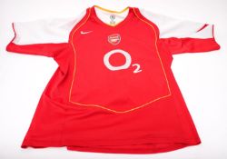 A 2006 Season Arsenal No. 11 shirt signed by Robin Van Persie and one other unsigned No.