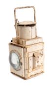 A BR (E) signal lamp in white with double bullseye clear lenses and red glass slip in filter.