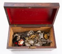 A collection of various British & Commonwealth Regimental cap badges and insignia: including