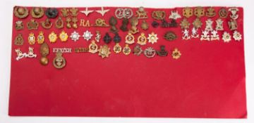 A collection of various collar and shoulder badges; including Somerset 2nd Volunteers Brigade,