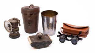 An early 20th century leather cased silver-plated hunting cup,