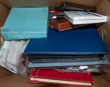 An accumulation of stamps in five albums and loose with mint Great British decimal sets, etc.