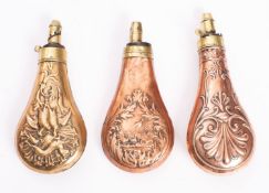 Three copper and brass powder flasks,