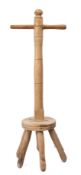 A turned beechwood and fruitwood washing dolly, with six legged base, 91.5cm high.