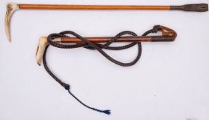 A white metal mounted antler handled riding whip,
