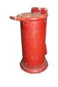 A cast aluminium counter top ticket punch in red (weathered)
