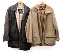 A Barbour Bushman black leather coat together with a ladies Barbour Tweed coat,