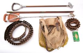Three leather cartridge belts, a canvas game bag, two shooting sticks, etc.
