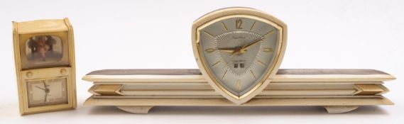 A mid 20th century Goldbuhl (Germany) white plastic musical alarm clock in the form of a television,