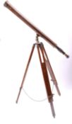 A late 20th Century brass refractor telescope on mahogany tripod.