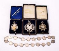 Three silver watch chain fob medallions together with a silver 3d necklace.