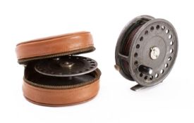 A Hardy 'St John' fly reel: single black handle, line tensioner and aluminium foot,