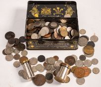 A collection of mixed coins including 1858 penny and two Magic Savings bank tins.