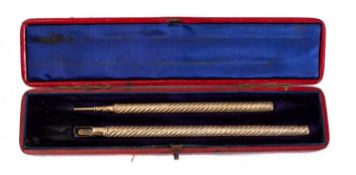 A cased gold-plated dip pen and propelling pencil set by S.