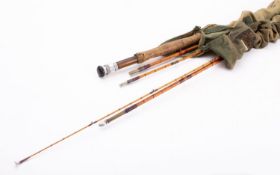 A Hardy 'The Gold Medal' three piece split cane rod in canvas bag together with a Hardy