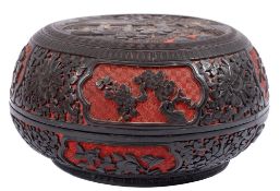 A Chinese black and red cinnabar lacquer bowl and cover: the cover decorated with figures beside a