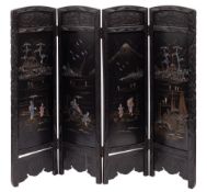 A Japanese carved, black lacquered and mother-of-pearl inset four fold screen,
