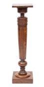 A Victorian friutwood pedestal, late 19th century; the square top above a knop turned, waisted,