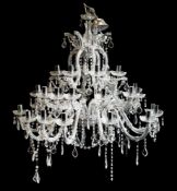 A contemporary cut glass three tier graduated twelve branch chandelier:,