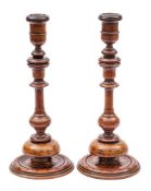A pair of turned fruitwood and inlaid candlesticks, 19th century,