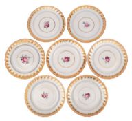 A set of six Derby plates and one matching each painted with a pink rose centred spray within a