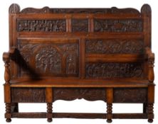 An oak hall settle,