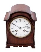 A small mahogany French mantle clock the eight-day duration movement striking the hours and