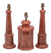 A pair of modern ceramic 'column' table lamps and one similar all covered with a marbled red and