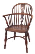 A late George III yew wood and elm Windsor elbow chair,