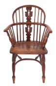 A late George III yew wood, beech and elm Windsor elbow chair,