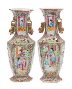 A pair of Canton hexagonal-section baluster vases with gilt lion dog handles, Qing dynasty,