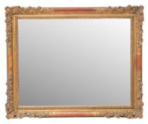 A gilt composition framed rectangular wall mirror in Louis XIV style,