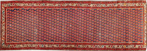 A Melayer Runner, the indigo field with a repeated boteh design,