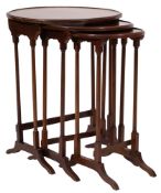 A nest of three mahogany circular occasional tables,