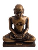 A Jain bronze figure of Suparsvanatha seated in the lotus position,