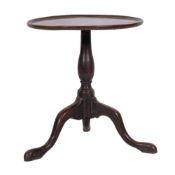 A George II mahogany circular tripod table, mid 18th century; the top with ribbed edging,