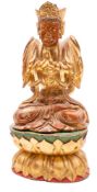 A Chinese gilt and polychrome decorated carved wood figure of a Bodhisattva with multi-arms,