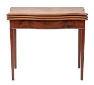 A George III mahogany serpentine front combined tea and card table,