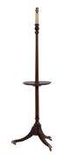 A mahogany standard lamp in Regency taste,