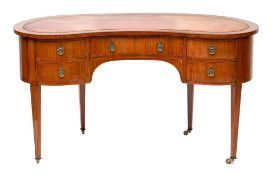 A mahogany and crossbanded kidney shaped desk in George III style,