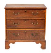 A George III oak chest of drawers,