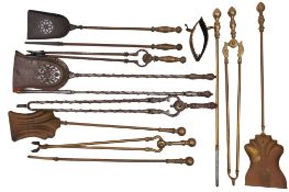 A set of Victorian steel fire irons in George III style, late 19th century; comprising shovel,