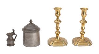 A pair of George II brass candlesticks, mid-18th century,