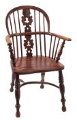 A late George III yew wood and elm Windsor elbow chair,