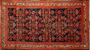 A Melayer Rug the indigo herati field with geometric designs enclosed by a main ivory palmette