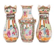 A pair of Canton vases and one similar, Qing Dynasty the pair with lotus petal rims,